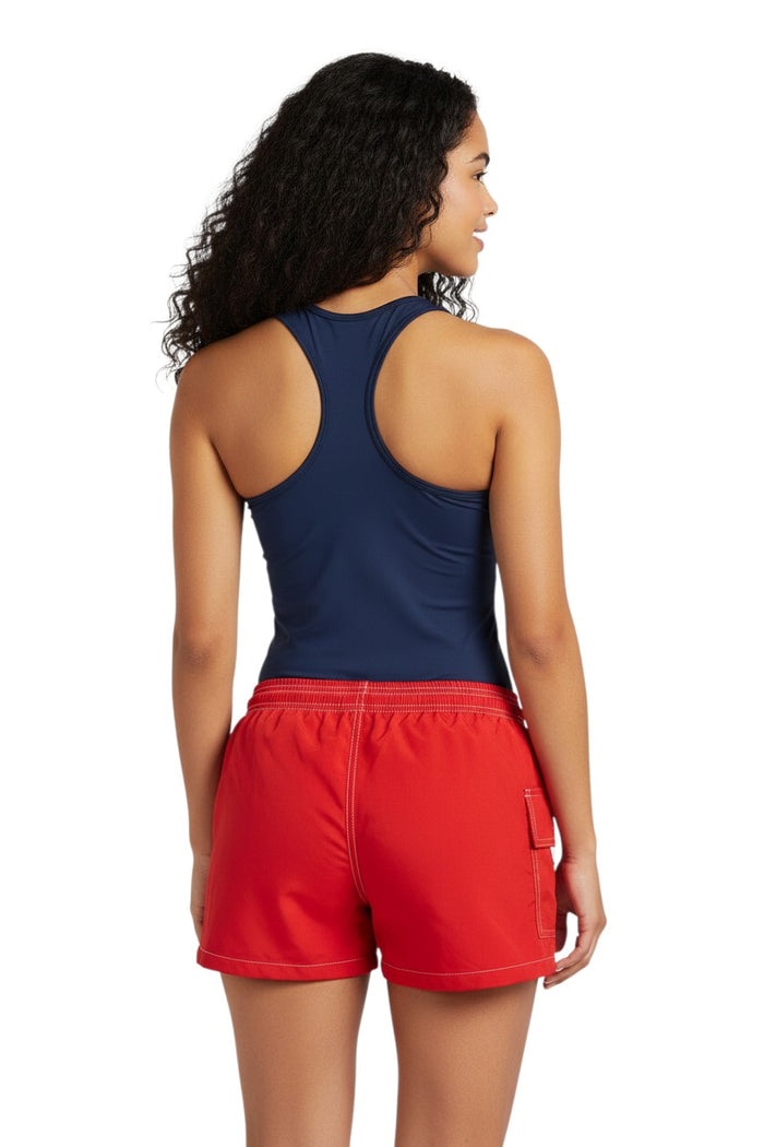 The Lifeguard Store RISE Solid Flex red polyester-spandex board shorts with side pocket and elastic waistband.