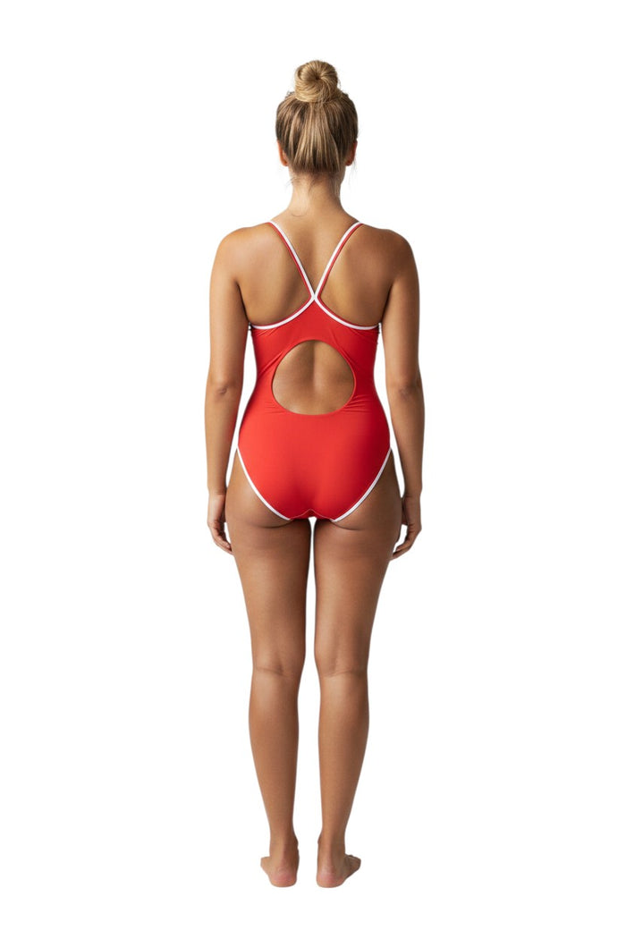 The Lifeguard Store RISE Solid H-Back Reversible one-piece swimsuit in red with white trim and a circular cutout on the back. Made of poly stretch fabric.