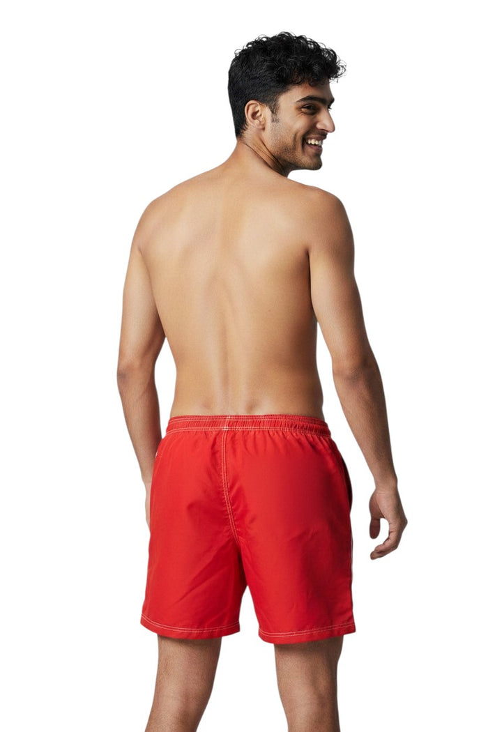 The Lifeguard Store red polyester-spandex boardshorts with contrast stitching, elastic waistband, and back pocket.