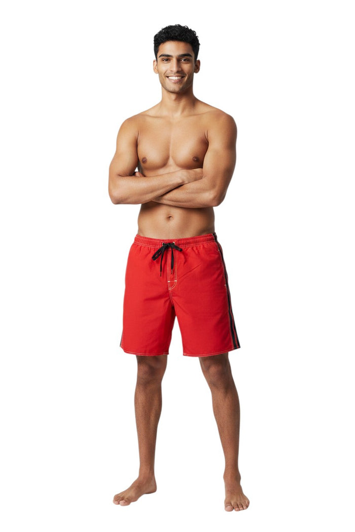 The Lifeguard Store red polyester board shorts with black side stripe, drawstring waist, and white contrast stitching.
