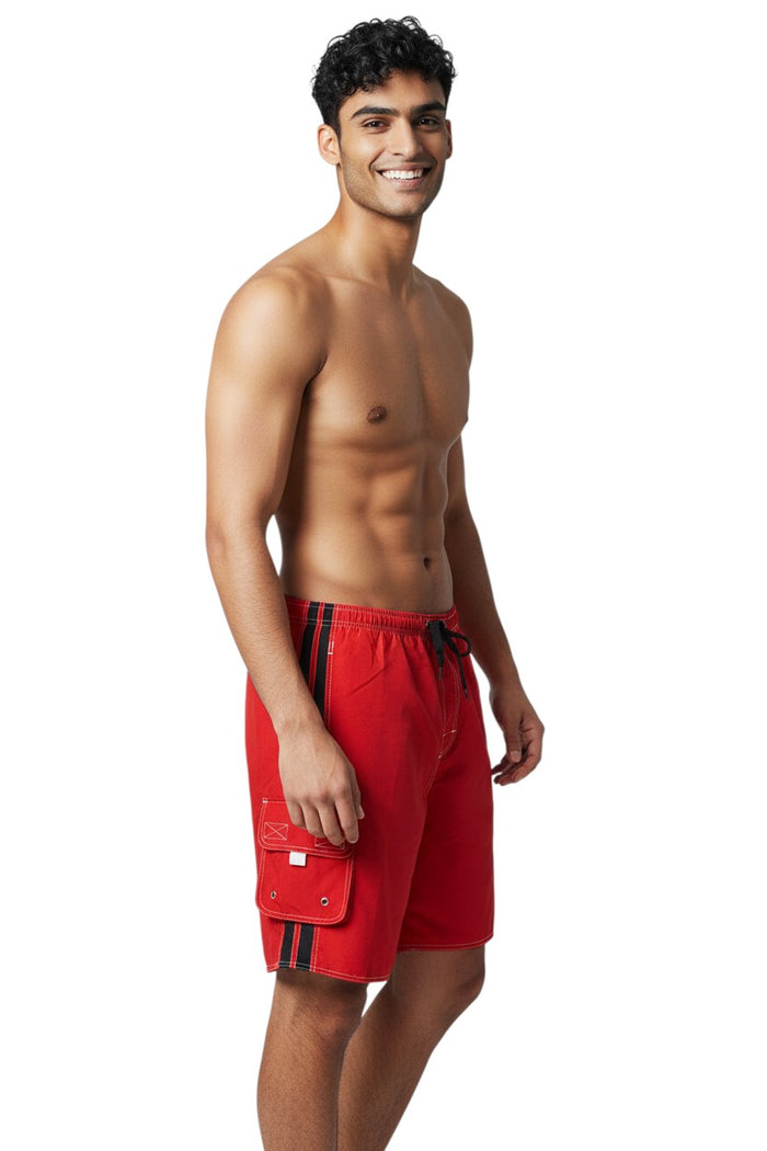 The Lifeguard Store red polyester board shorts with black side stripes, drawstring waist, and cargo pocket.