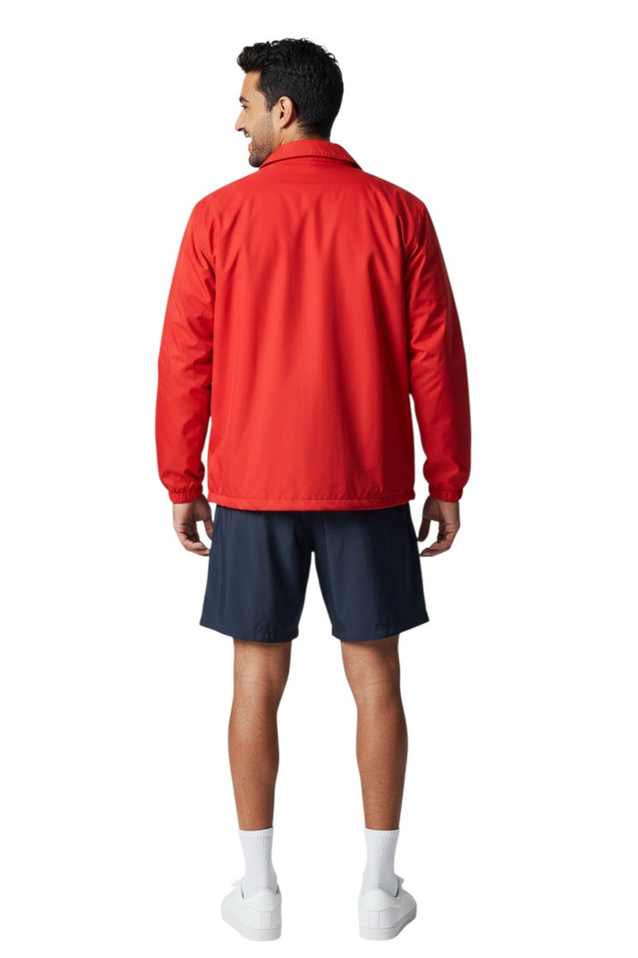 The Lifeguard Store RISE Solid Waterproof Jacket in red, made of polyurethane with heat-sealed seams and adjustable hood.