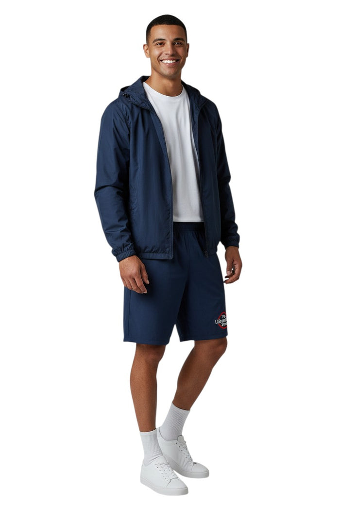 The Lifeguard Store RISE Solid Waterproof Jacket in navy blue, made of polyurethane with a full zip and adjustable hood.
