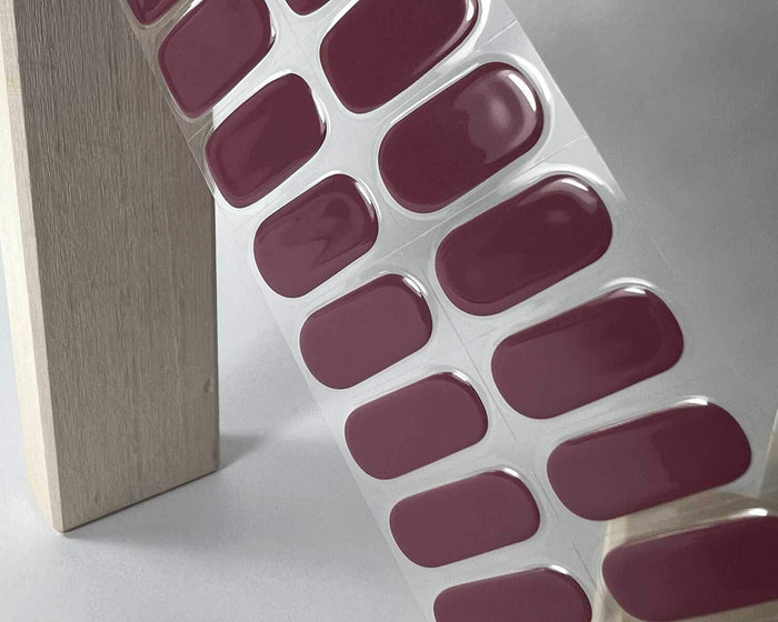 Mulberry semi-cured gel nail wraps on a nail mock-up, alternate angle