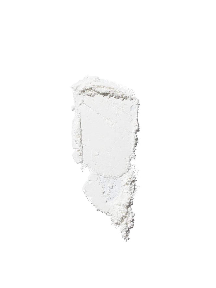 Swatch of finely milled white setting powder with a soft, matte finish.