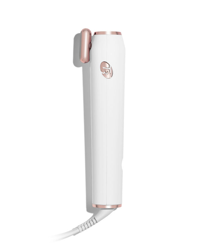 White and rose gold hair straightener on a white background