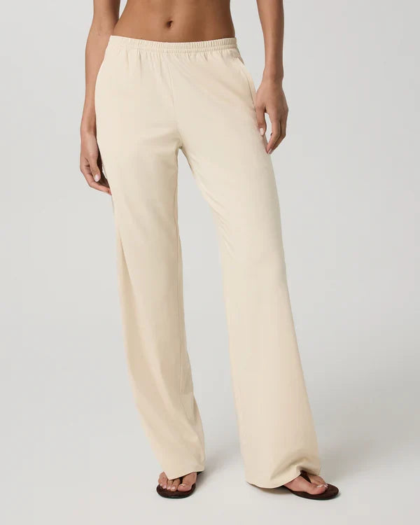 Person wearing Vuori - Villa Everyday Wideleg pants on a plain background