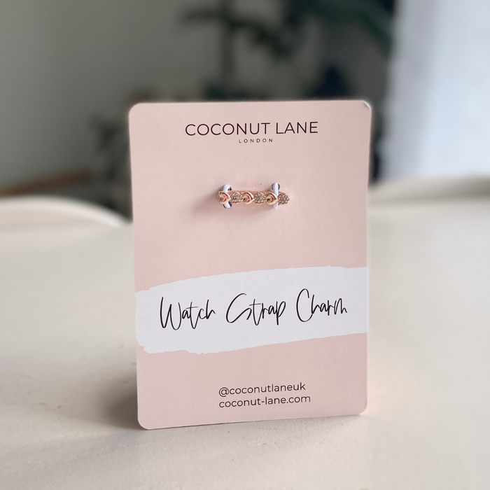 Rose gold diamante heart watch strap charm by Coconut Lane on a pink card labeled Watch Strap Charm.