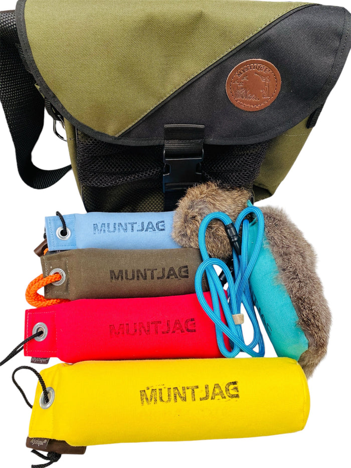 Collection of Muntjac products including a bag, gundog dummys, and a half fur half canvas dummy next to a fur tennis ball on a white background
