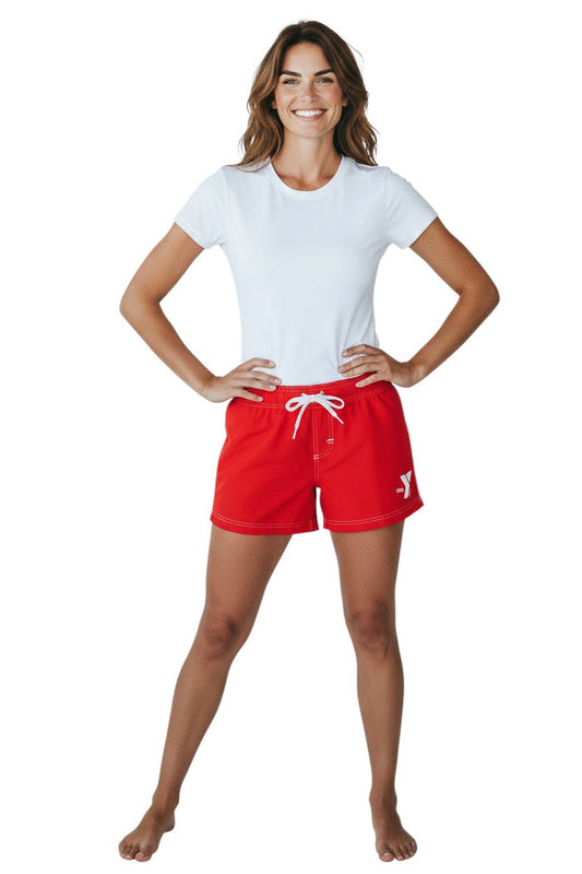 The Lifeguard Store red polyester swim shorts with 5" inseam, elastic waistband, drawstring, and side pocket. Features white YMCA logo.