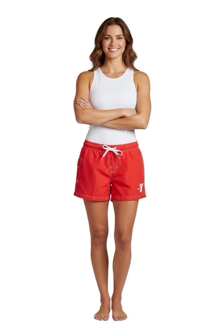 The Lifeguard Store red polyester swim shorts with 5" inseam, elastic waistband, drawstring, and side pocket. Features white YMCA logo.