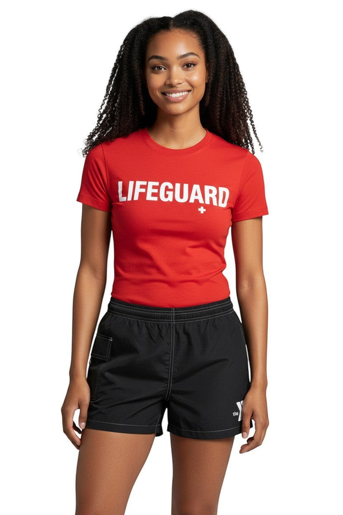 The Lifeguard Store black polyester-spandex YMCA board shorts with elastic waistband, drawstring, and side pocket.
