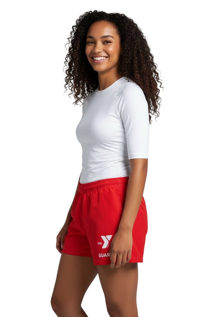 The Lifeguard Store YMCA Guard red polyester-spandex board shorts with elastic waistband and side pocket.