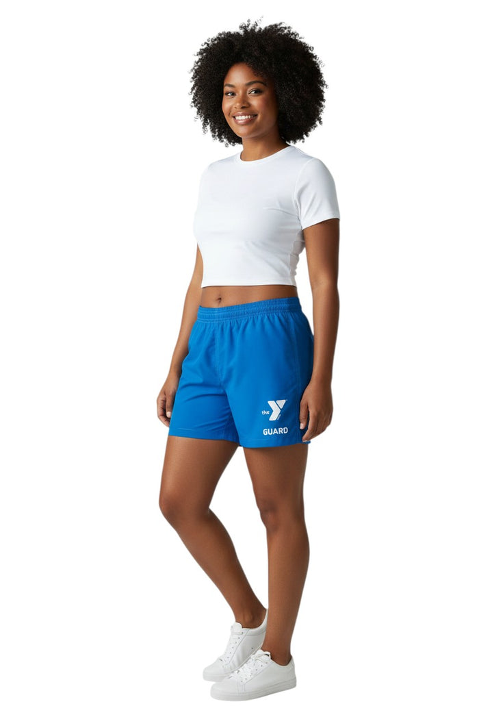 The Lifeguard Store blue polyester-spandex board shorts with elastic waistband, side pocket, and YMCA Guard logo.