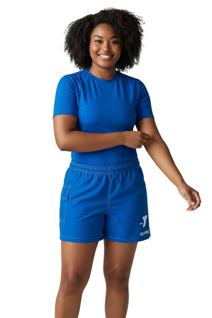 The Lifeguard Store YMCA Guard blue polyester-spandex board shorts with elastic waistband and side pocket.