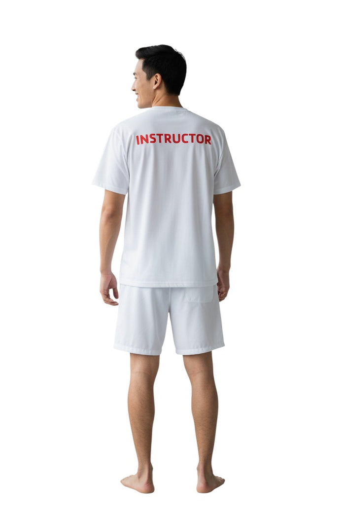 The Lifeguard Store white 100% polyester Dri-Fit tee with red "INSTRUCTOR" screened on the upper back.