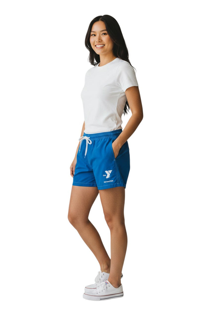 The Lifeguard Store blue polyester-spandex board shorts with elastic waistband, drawstring, and side pocket featuring YMCA Instructor logo.
