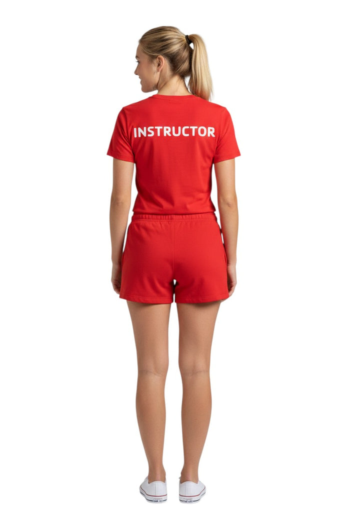 The Lifeguard Store red short sleeve rashguard with white "INSTRUCTOR" text on back. Made of 91% polyester/9% spandex.